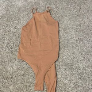 Tan body suit